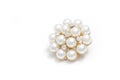 Gold round brooch with pearls on white background