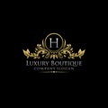 Gold Royal Luxury Boutique H Letter Logo. Royalty Free Stock Photo