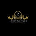 Gold Royal Luxury Boutique R Letter Logo. Royalty Free Stock Photo