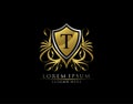 Gold Royal Shield T Letter Logo. Graceful Elegant gold shield icon design