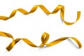 Gold satin ribbon metallic bright yellow golden brilliant curly bow color isolated on white background with clipping path Royalty Free Stock Photo