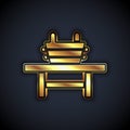 Gold Sauna bench with bucket icon isolated on black background. Vector