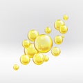 Gold serum oil droplets isolated on greyish background. Yellow collagen bubbles with sparkles and lights composition. Golden Royalty Free Stock Photo