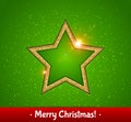 Gold shining star, green background. Christmas greeting card