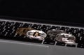 Gold and silver bitcoins, monero and litecoin coins on laptop keyboard, new digital virtual money Royalty Free Stock Photo