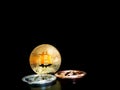 Gold, silver, and bronze Bitcoin coins with bitcoin symbol, Placed on a black background