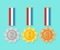 Gold, silver, bronze medal for first place. Trophy, award for winner isolated on blue background. Set of golden badge with ribbon Royalty Free Stock Photo