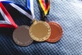 Gold, silver and bronze medal on velvet cushion Royalty Free Stock Photo