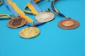 Gold, silver and bronze medals on the blue surface. Medals Of Ukraine Royalty Free Stock Photo