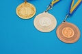 Gold, silver and bronze medals on the blue surface. Medals Of Ukraine Royalty Free Stock Photo