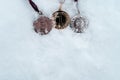 Gold, silver and bronze medals with numbers on snow background