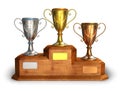 Gold, silver and bronze trophy cups on pedestal Royalty Free Stock Photo