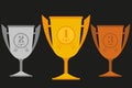 Gold, silver, bronze trophy in flat icons set. Vector. Royalty Free Stock Photo