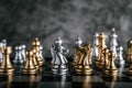 Gold and Silver Chess on chess board game for business metaphor leadership concept Royalty Free Stock Photo