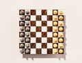 Gold and Silver chess game on wooden chess board, 3d rendered