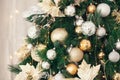 Gold and silver Christmas toys, balls garlands on a spruce branch Royalty Free Stock Photo