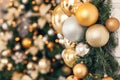 Gold and silver Christmas toys, balls garlands on a spruce branch Royalty Free Stock Photo