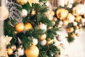 Gold and silver Christmas toys, balls garlands on a spruce branch Royalty Free Stock Photo