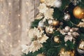 Gold and silver Christmas toys, balls garlands on a spruce branch with copy space Royalty Free Stock Photo