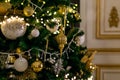 Gold and silver Christmas toys, balls and garlands on a spruce branch on christmas tree Royalty Free Stock Photo