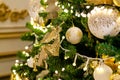 Gold and silver Christmas toys, balls and garlands on a spruce branch on christmas tree Royalty Free Stock Photo