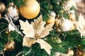 Gold and silver Christmas toys, balls, golden flowers, garlands on a spruce branch Royalty Free Stock Photo