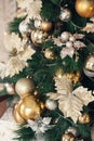 Gold and silver Christmas toys, balls, golden flowers, garlands on a spruce branch Royalty Free Stock Photo