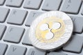Gold and silver coin - Ripple crypto currency. Virtual currency on the keys Royalty Free Stock Photo