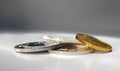 Gold and silver coins in close-up on a grey background Royalty Free Stock Photo