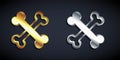 Gold and silver Crossed bones icon isolated on black background. Pets food symbol. Happy Halloween party. Long shadow Royalty Free Stock Photo