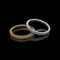 Gold and Silver with diamond wedding rings on black background-3D image Royalty Free Stock Photo