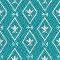 Gold and silver Fleur de Lys design. Classic style with a modern twist. Seamless vector pattern on Caribbean blue