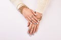 Gold and silver jewelry on women`s hands. Royalty Free Stock Photo
