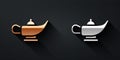 Gold and silver Magic lamp or Aladdin lamp icon isolated on black background. Spiritual lamp for wish. Long shadow style