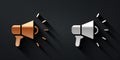 Gold and silver Megaphone icon isolated on black background. Speaker sign. Long shadow style. Vector