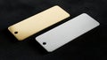 Gold and Silver Metal Plates on Black Textured Surface Royalty Free Stock Photo