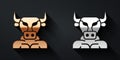 Gold and silver Minotaur icon isolated on black background. Mythical greek powerful creature the half human bull
