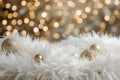 Gold and Silver Ornaments on Soft White Surface with Warm Bokeh Lights Royalty Free Stock Photo