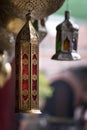 Gold & silver metal lamps hanging from a shop in a Marrakech souk Royalty Free Stock Photo