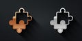 Gold and silver Puzzle pieces toy icon isolated on black background. Long shadow style. Vector Royalty Free Stock Photo