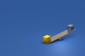 Gold and silver weights placed on both ends of the seesaw. Gold weights tilt downwards. Royalty Free Stock Photo