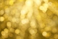 Gold sparkle glitter bokeh from light bulb abstract patterns for Christmas and Happy new year background Royalty Free Stock Photo