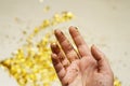 Gold sparkles in the palm of your hand Royalty Free Stock Photo