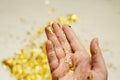 Gold sparkles in the palm of your hand Royalty Free Stock Photo