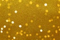 Gold sparkling festive background, bokeh lights, soft selective focus, close-up. Copy space for text. Horizontal. Celebration, Royalty Free Stock Photo