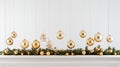 Gold sparkling holiday ornaments gracefully hanging from a fir branch against a pristine white background highlight the Royalty Free Stock Photo