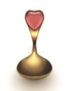Gold spoon with heart emblem on handle