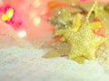 A gold star for Christmas decorations on knit fabric and a colorful background with the concept of celebration,Christmas, New Year Royalty Free Stock Photo