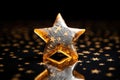 gold star-patterned cracker on a shiny glass surface Royalty Free Stock Photo