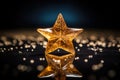 gold star-patterned cracker on a shiny glass surface Royalty Free Stock Photo